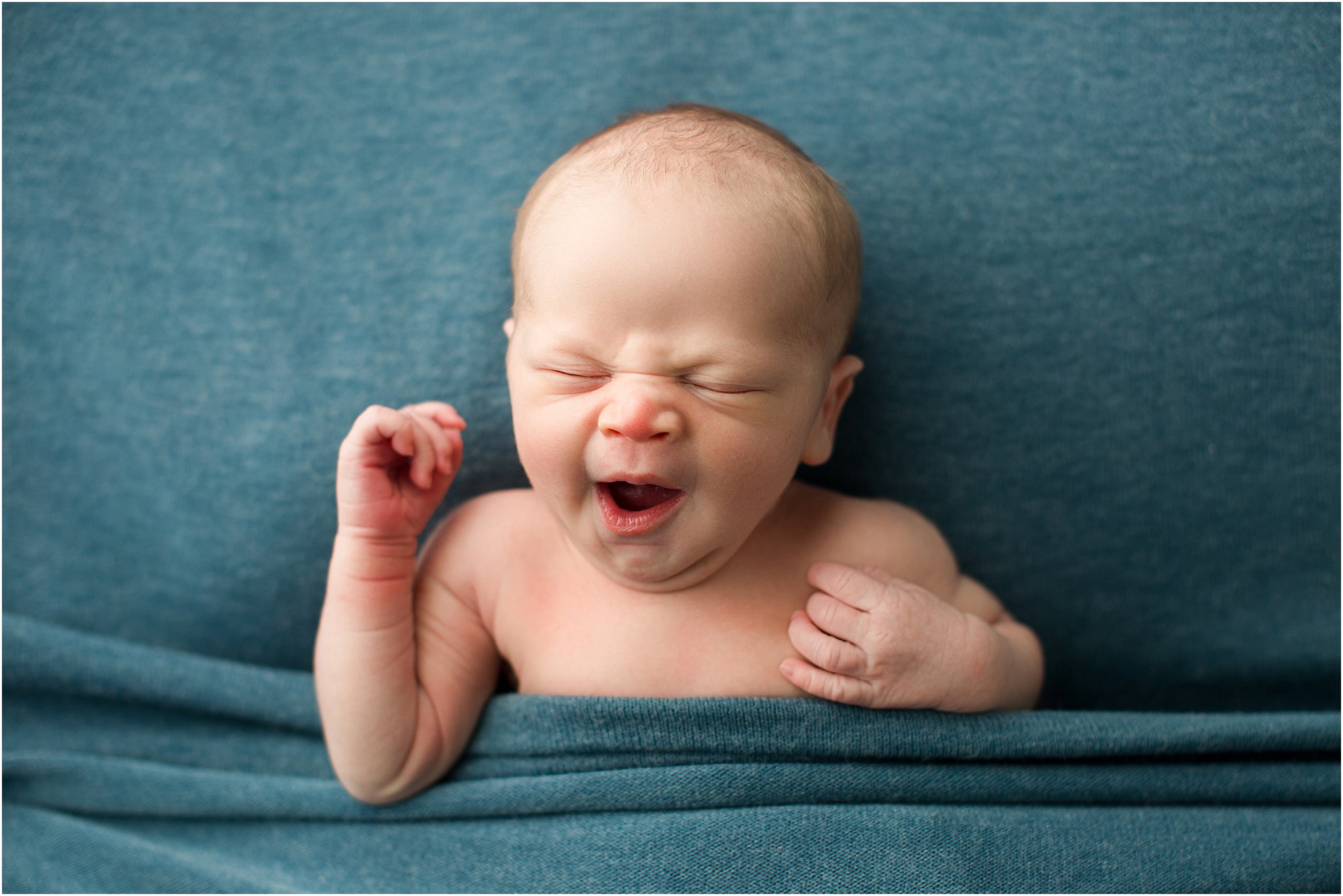 newborn baby boy yawning 