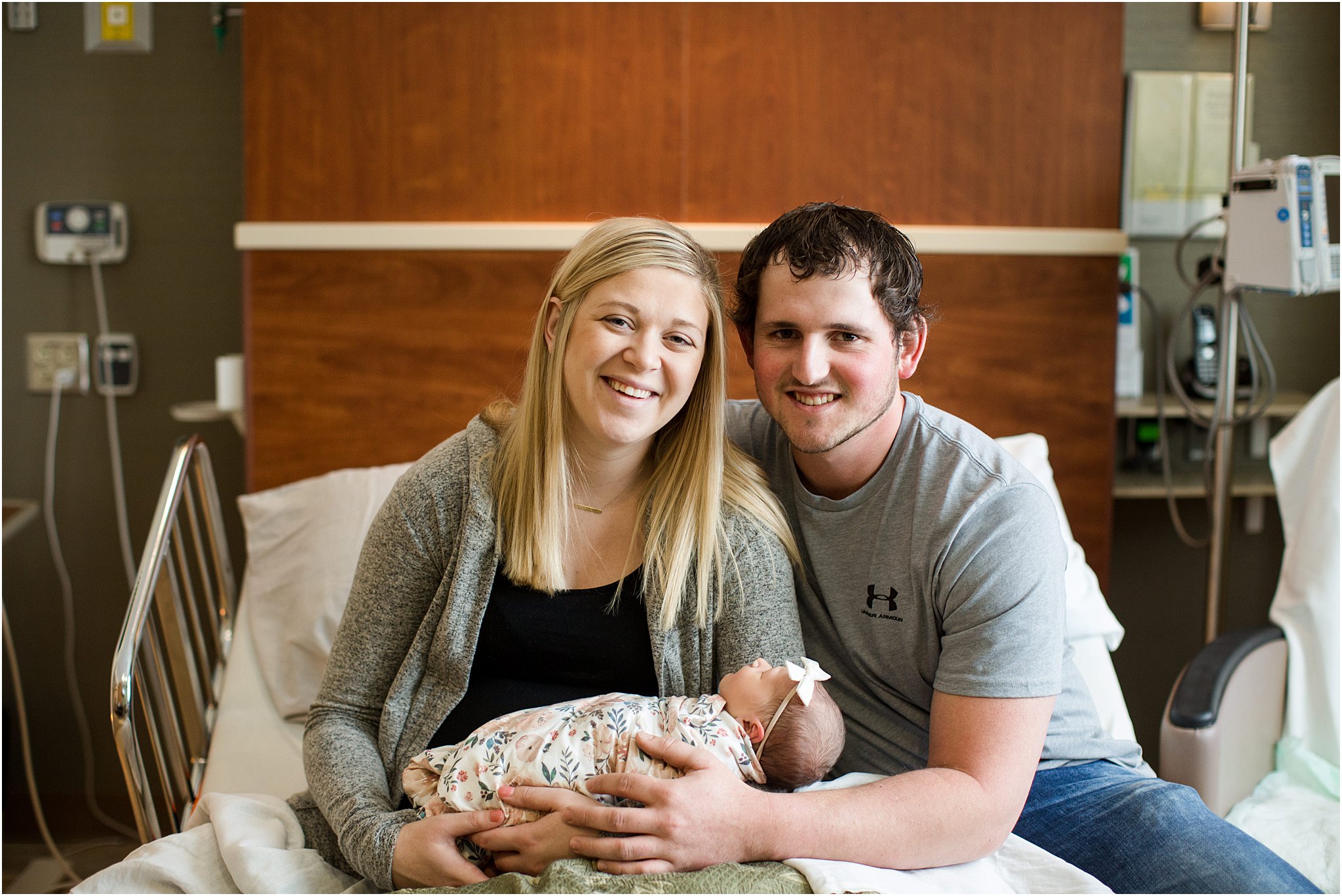 family of three with newborn