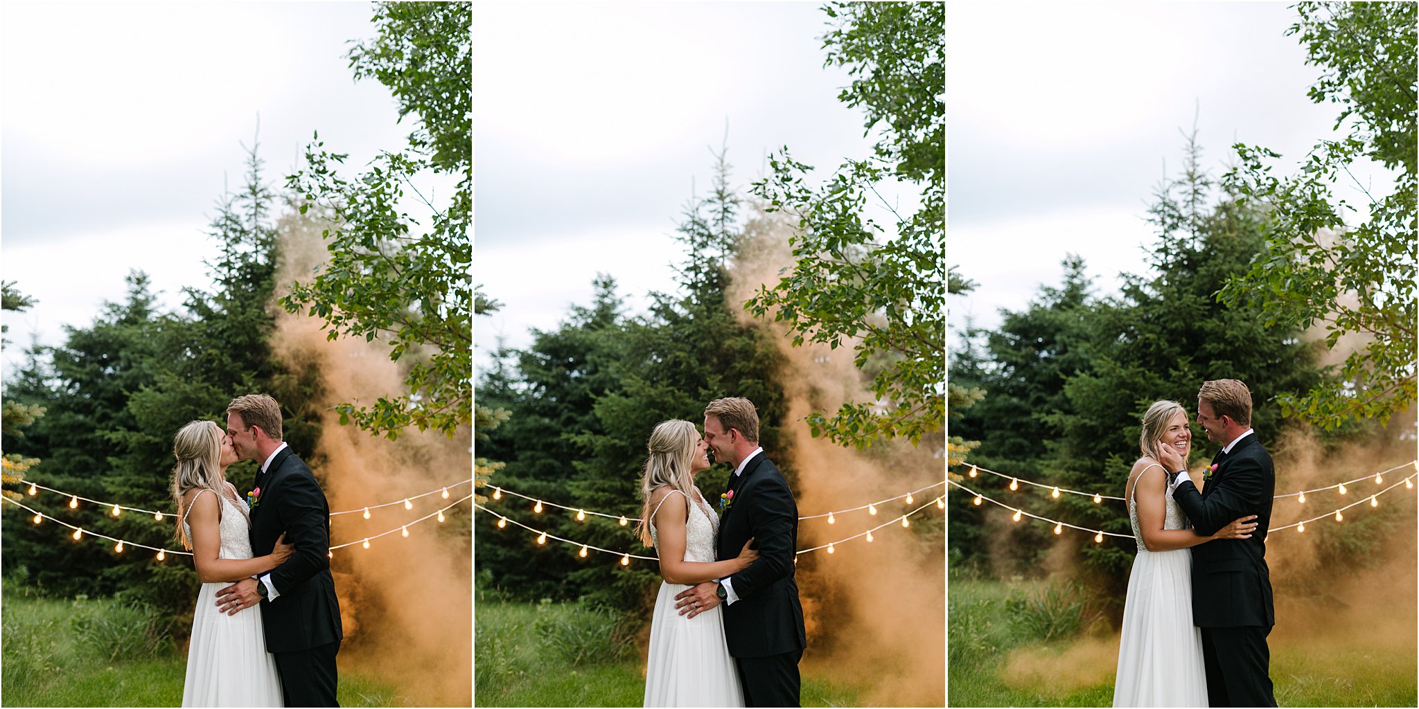 wedding couple dancing with orange smoke and twinkle lights