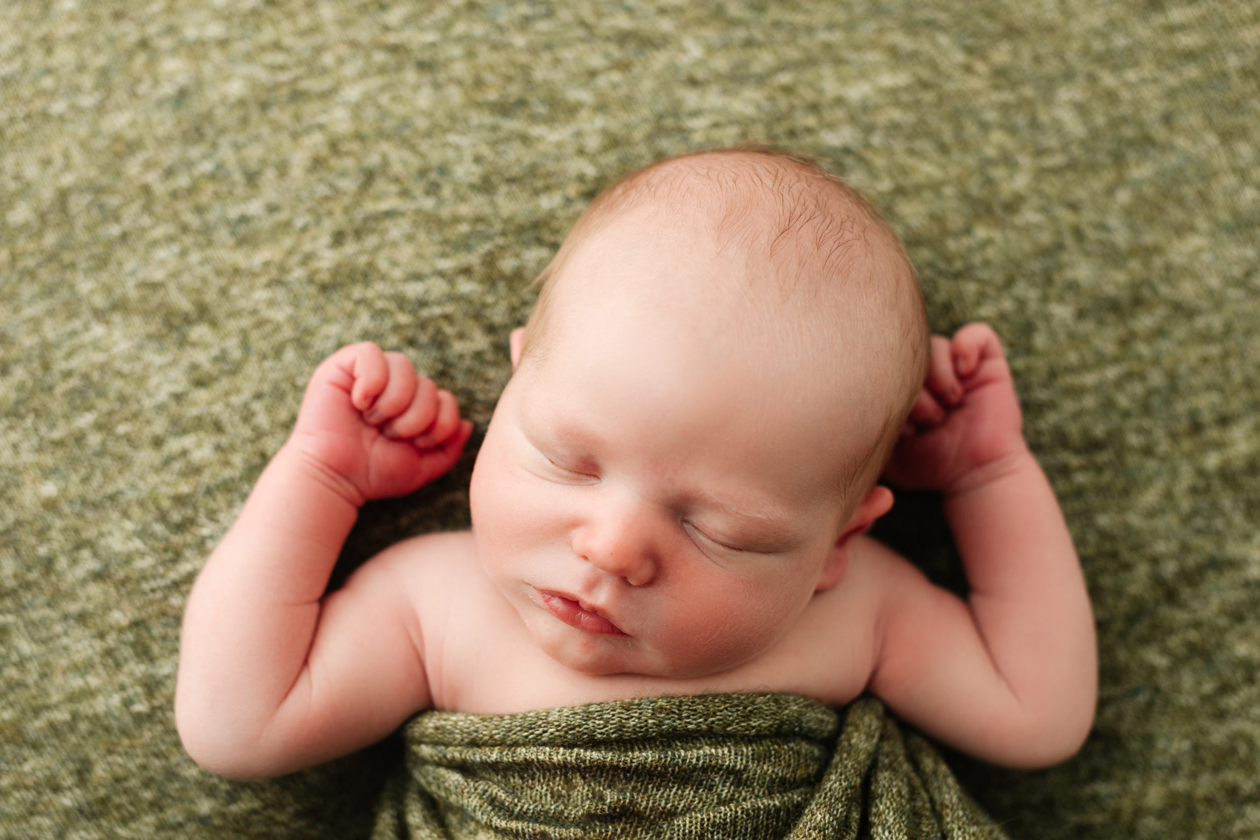 baby boy at newborn session green